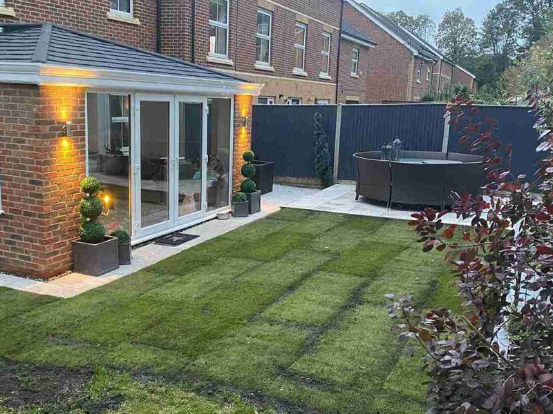 365 warm roof conservatory in a well manicured garden